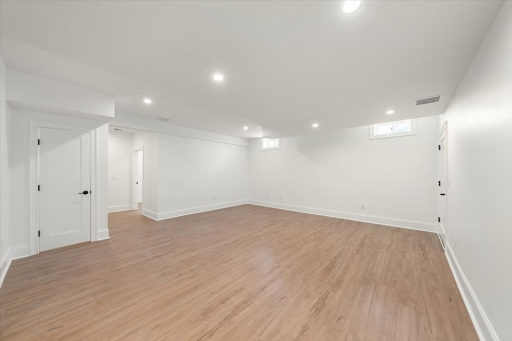 37 Longfellow Road Natick, MA 01760 - Photo 24 of 25 a view of an empty room with wooden floor and a window