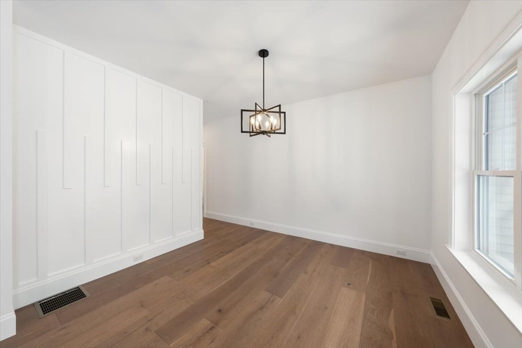 37 Longfellow Road Natick, MA 01760 - Photo 4 of 25 a view of a room with wooden floor and windows
