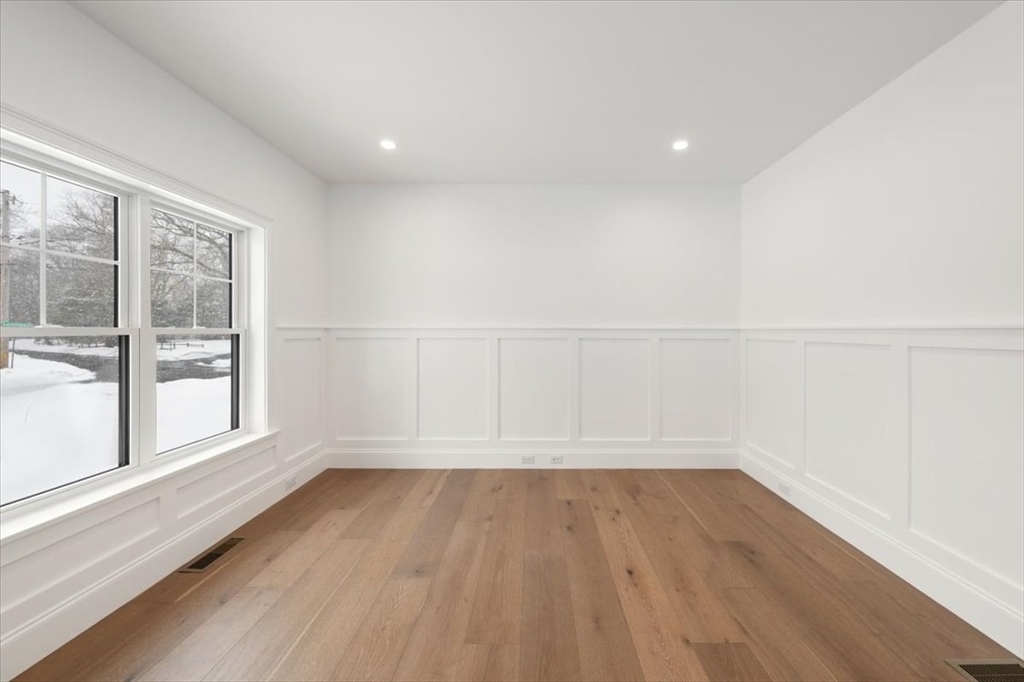 37 Longfellow Road Natick, MA 01760 - Photo 5 of 25 wooden floor in an empty room with a window