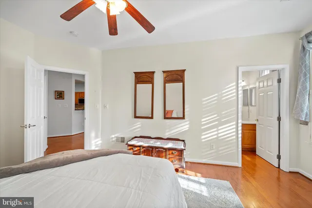 a bathroom with a sink vanity mirror and toilet