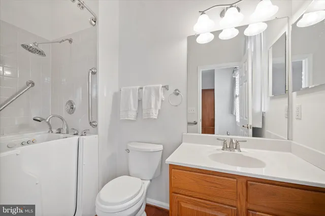 a view of a livingroom with a ceiling fan and window
