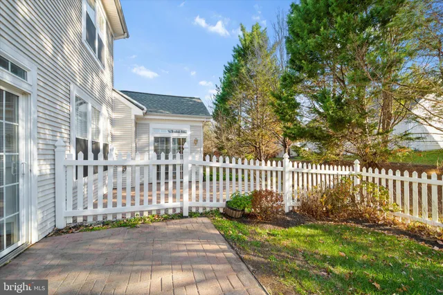 a view of a yard with a house and a garden