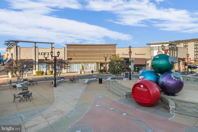 a front view of a building with retail shops