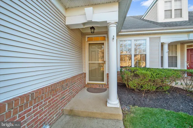 a front view of a house with a porch