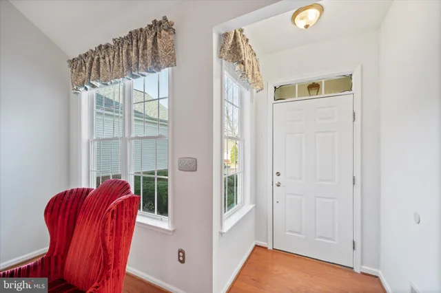 a view of a room that has a bed and a window