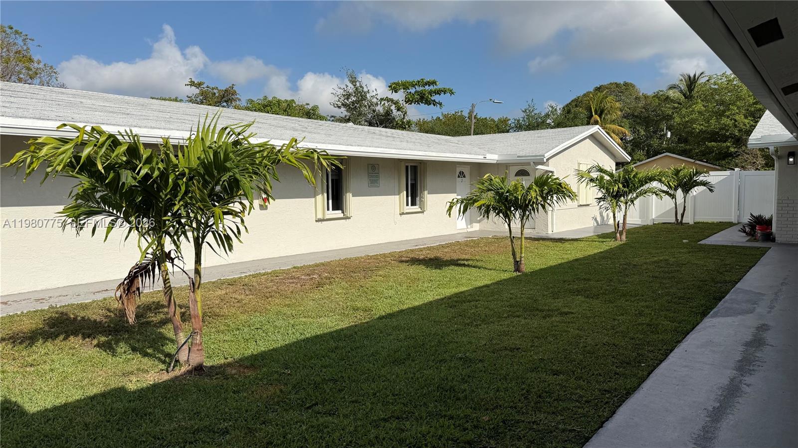220 Northwest 12th Street Pompano Beach, FL 33060 - Photo 11 of 77 a view of a house with a yard