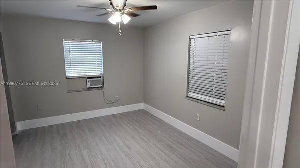 a bathroom with a toilet and a bathtub