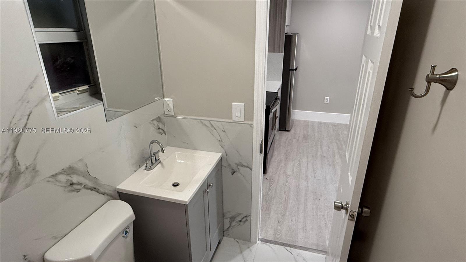 220 Northwest 12th Street Pompano Beach, FL 33060 - Photo 30 of 77 a bathroom with a sink toilet and tub