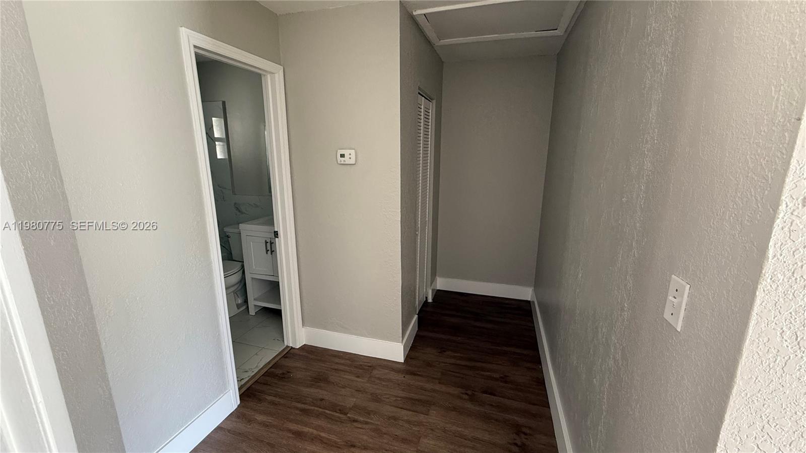220 Northwest 12th Street Pompano Beach, FL 33060 - Photo 50 of 77 a view of a hallway with wooden floor