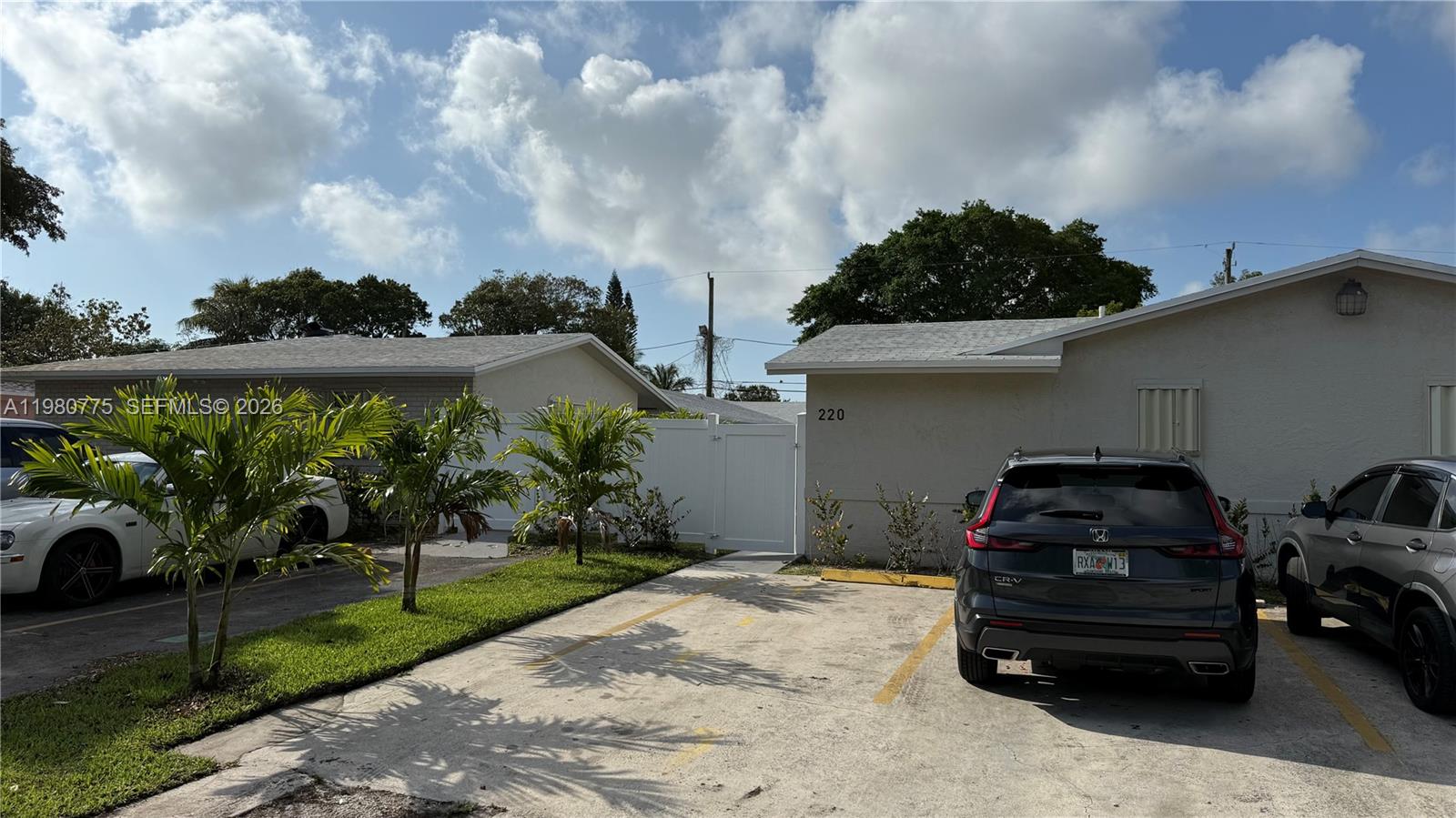 220 Northwest 12th Street Pompano Beach, FL 33060 - Photo 5 of 77 a car parked in front of a house