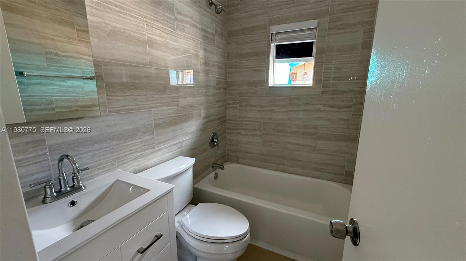 220 Northwest 12th Street Pompano Beach, FL 33060 - Photo 65 of 77 a bathroom with a sink toilet and shower