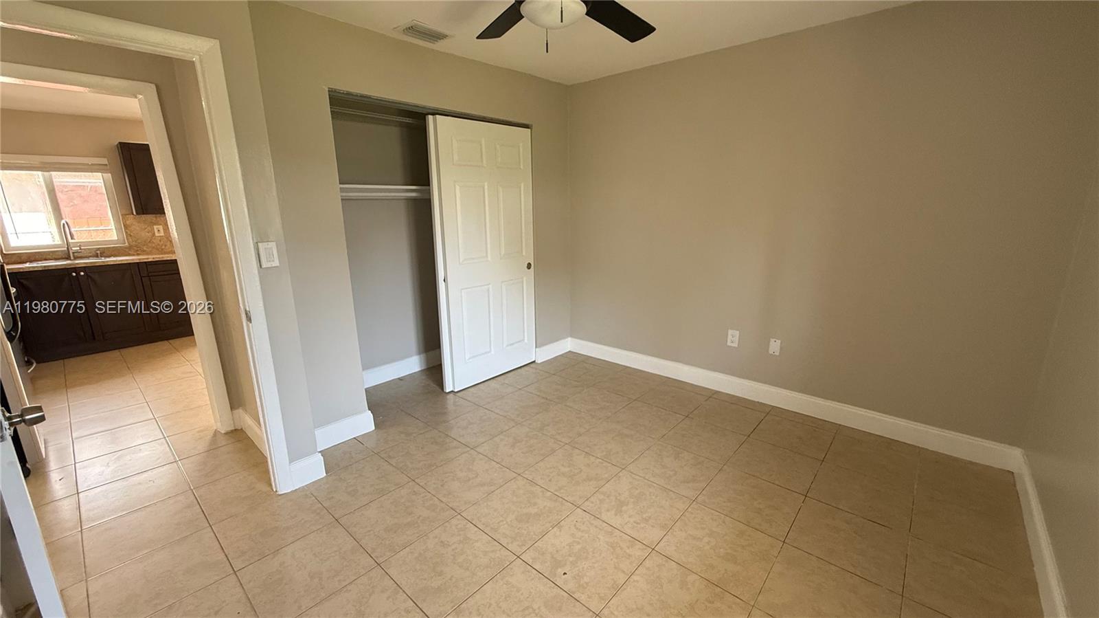 220 Northwest 12th Street Pompano Beach, FL 33060 - Photo 71 of 77 a view of a livingroom with wooden floor and a ceiling fan