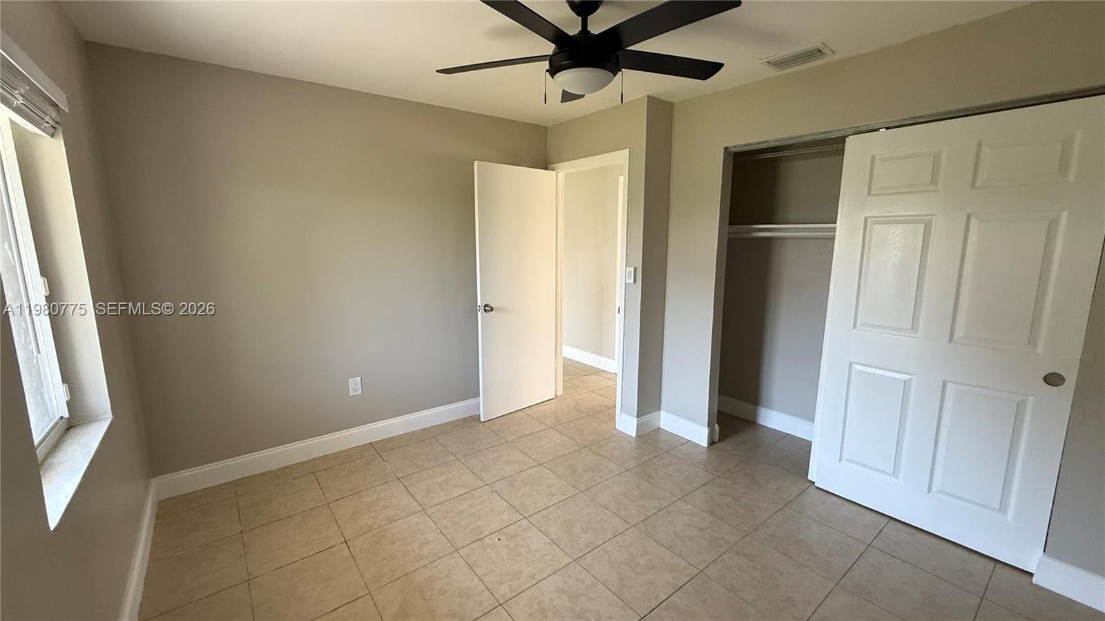 220 Northwest 12th Street Pompano Beach, FL 33060 - Photo 72 of 77 a view of an empty room with a window