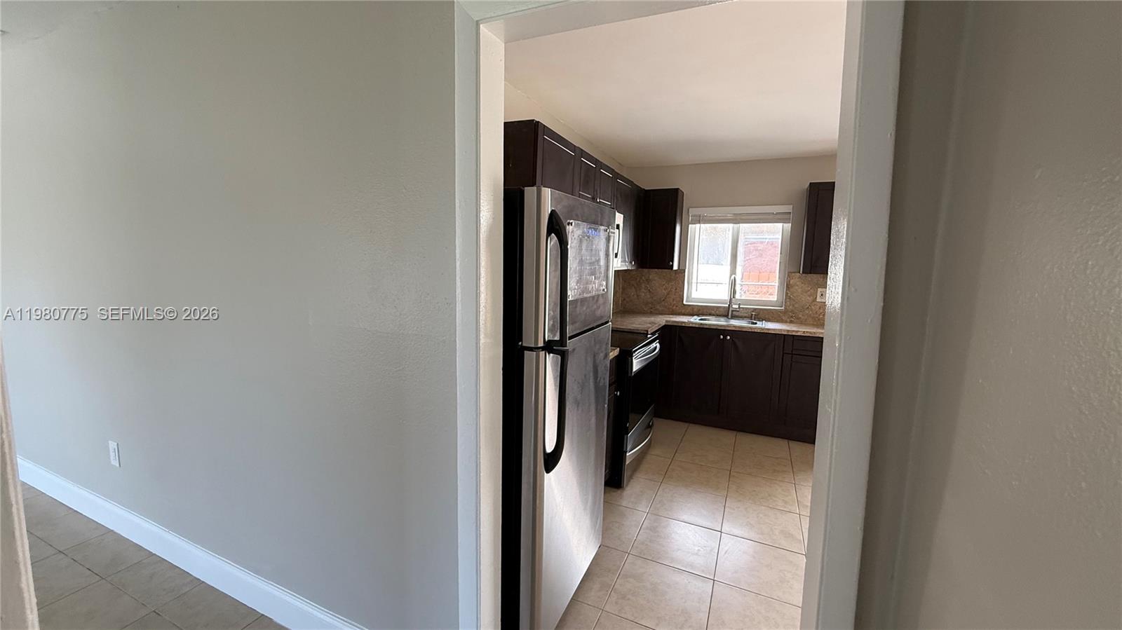 220 Northwest 12th Street Pompano Beach, FL 33060 - Photo 73 of 77 a view of a hallway and a livingroom with furniture