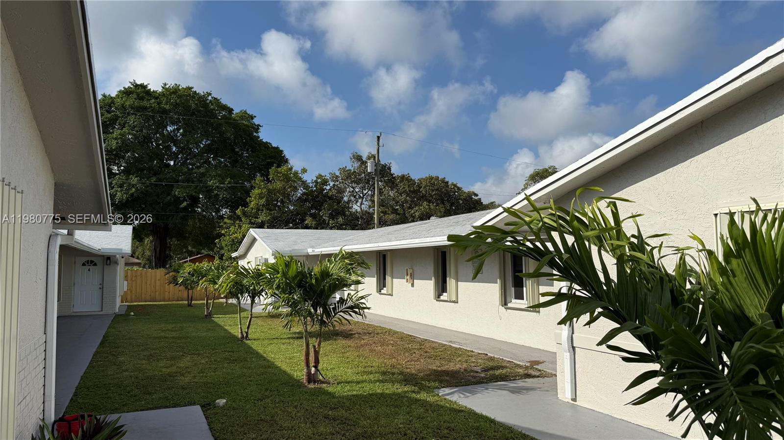 220 Northwest 12th Street Pompano Beach, FL 33060 - Photo 8 of 77 a front view of a house with a yard
