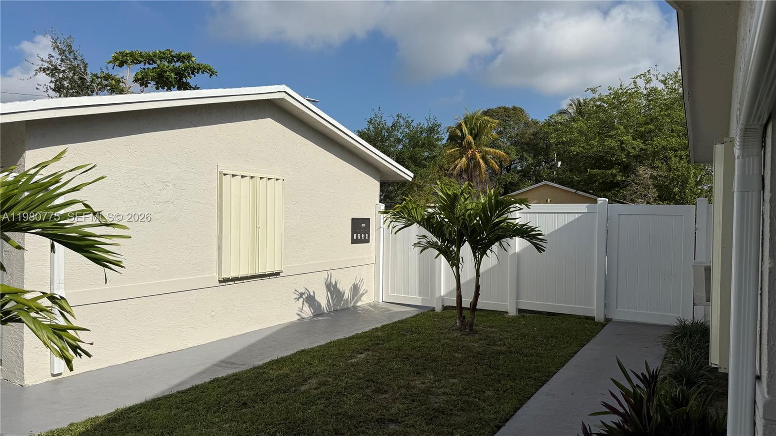 220 Northwest 12th Street Pompano Beach, FL 33060 - Photo 9 of 77 a view of a house with a yard and potted plants