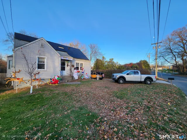 a view of cars parked in front of a house