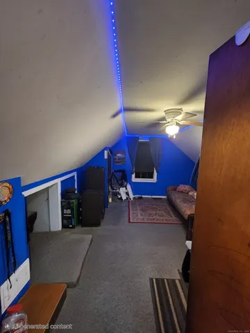 a bedroom with bed and a window