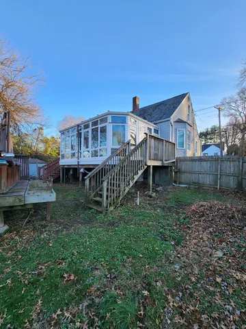 a view of backyard with large trees
