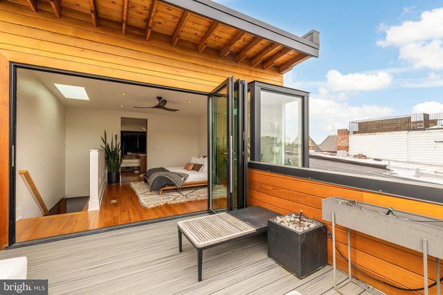 a room with lots of counter top space and two windows