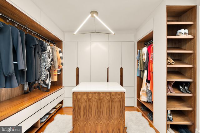 a bathroom with a sink mirror and vanity