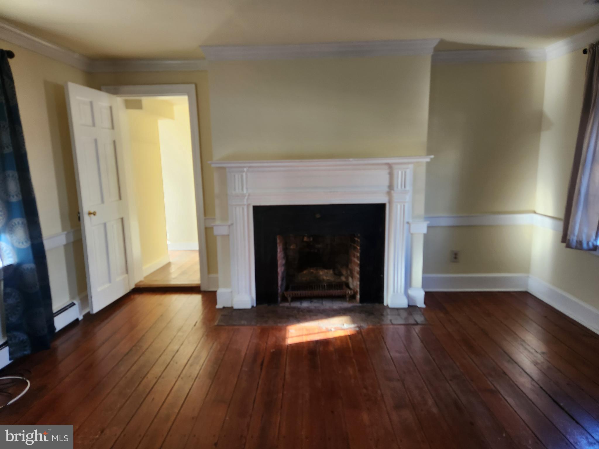 316 Princess Anne Street Fredericksburg, VA 22401 - Photo 19 of 44 a view of an empty room with wooden floor and a window