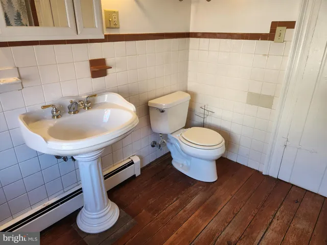 a view of a bathroom with shower and a curtain