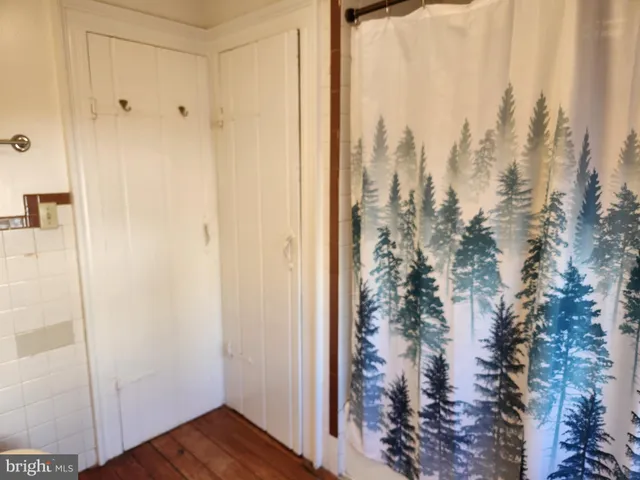 a bathroom with a toilet a sink and a mirror