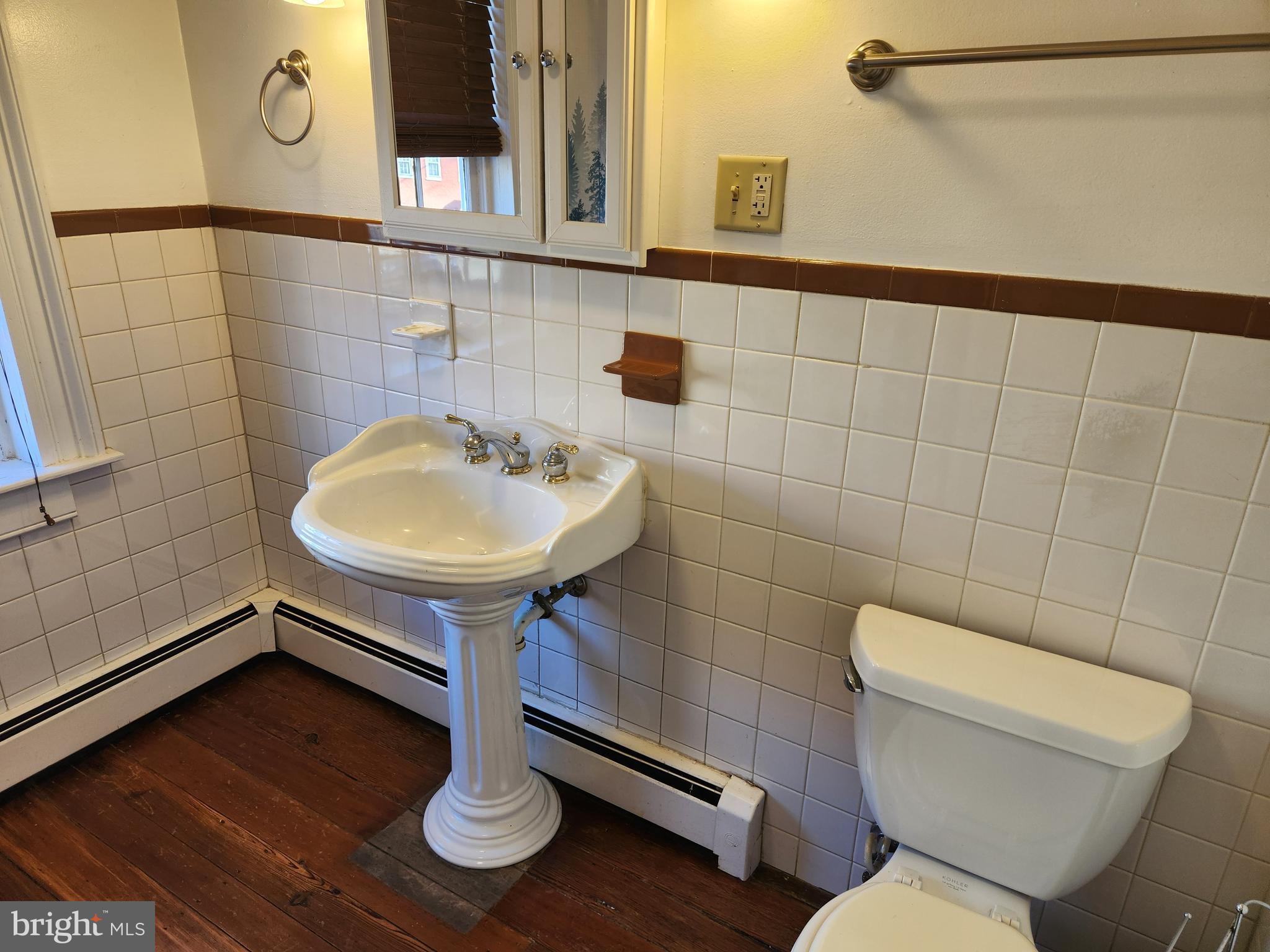 316 Princess Anne Street Fredericksburg, VA 22401 - Photo 22 of 44 a bathroom with a toilet a sink and a mirror