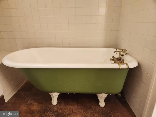 a bathroom with a sink a mirror and a toilet