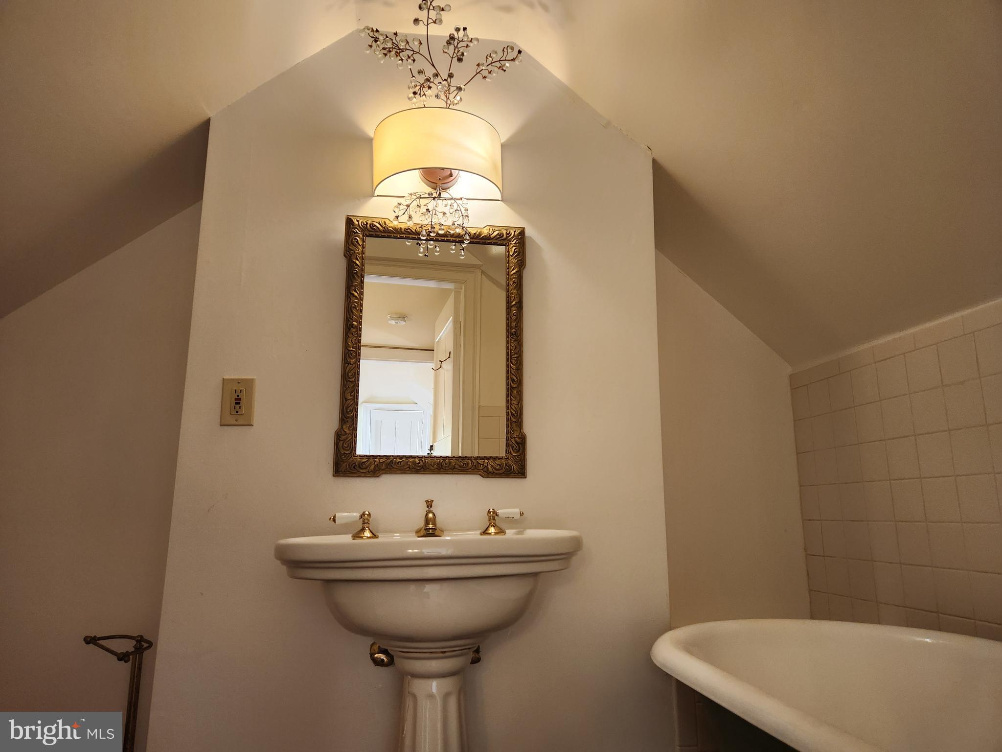 316 Princess Anne Street Fredericksburg, VA 22401 - Photo 30 of 44 a bathroom with a sink a mirror and a toilet