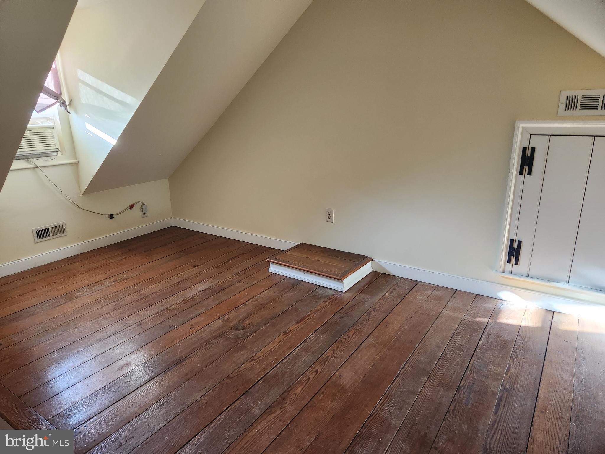 316 Princess Anne Street Fredericksburg, VA 22401 - Photo 33 of 44 an empty room with wooden floor and windows