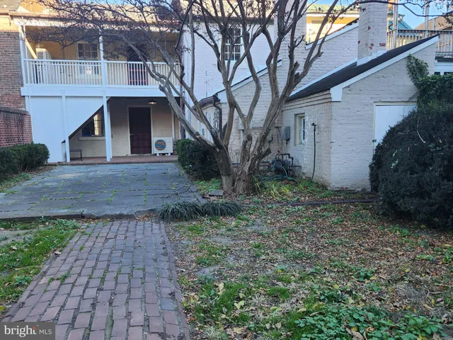 a view of a house with wooden deck