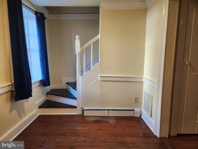 a view of entryway with wooden floor