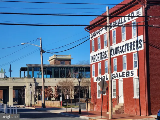 a view of an empty room and wooden floor