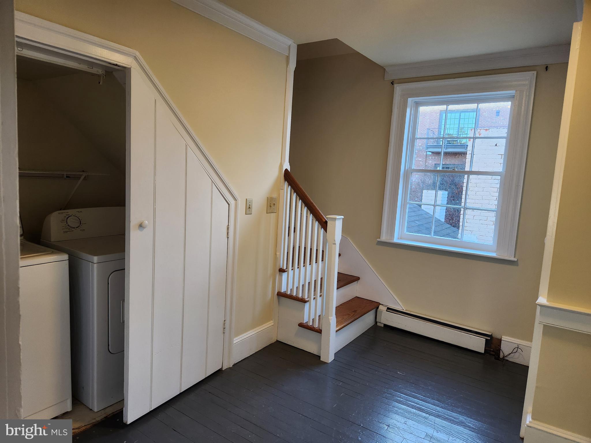 316 Princess Anne Street Fredericksburg, VA 22401 - Photo 43 of 44 a view of front door with wooden floor and stairs