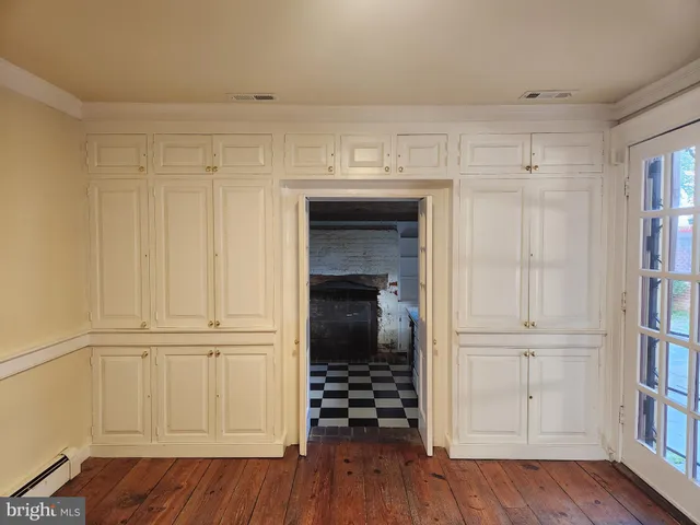 a view of a closet area with hallway
