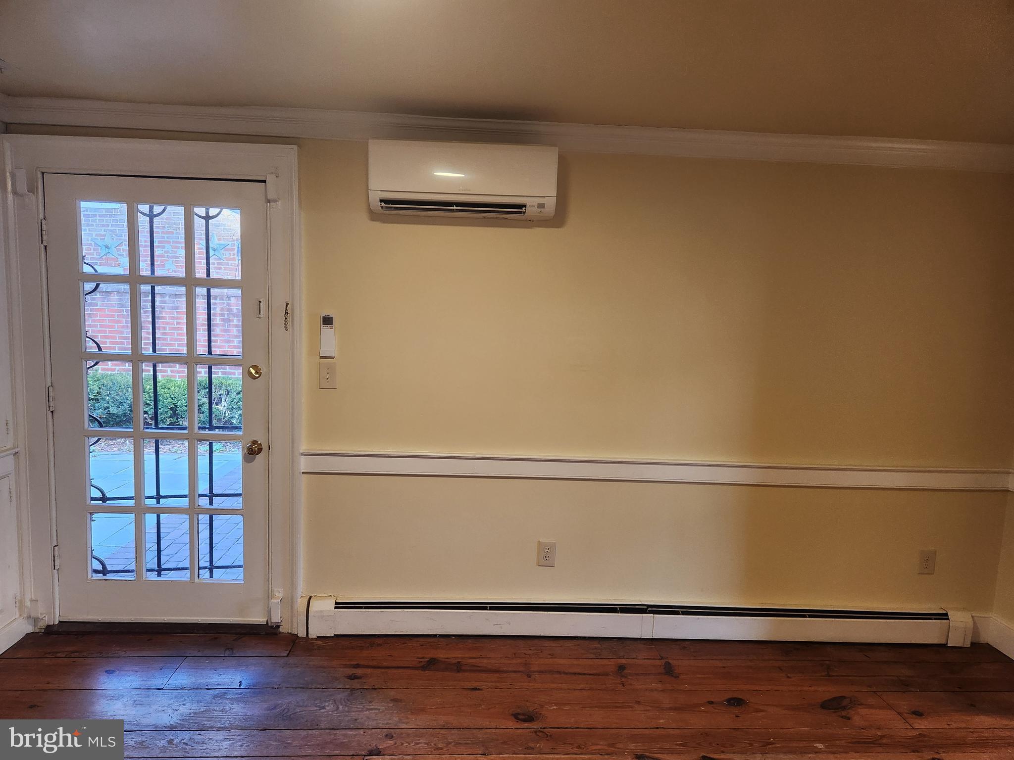 316 Princess Anne Street Fredericksburg, VA 22401 - Photo 8 of 44 a view of an empty room with wooden floor and a window