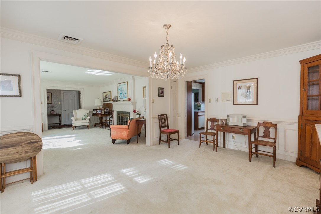 4131 East Old Gun Road Midlothian, VA 23113 - Photo 12 of 45 a living room with furniture and a chandelier