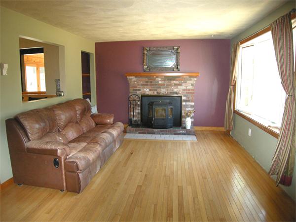 8 Kilsyth Road Easton, MA 02375 - Photo 6 of 7 a living room with furniture and a fireplace