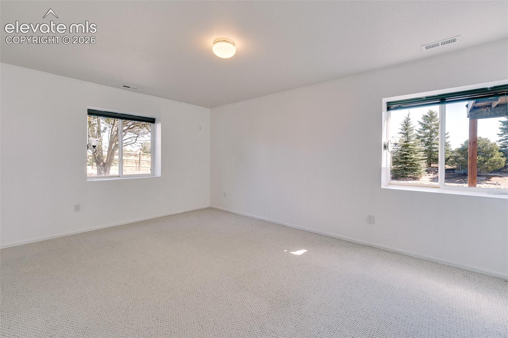 7869 Fort Smith Road Peyton, CO 80831 - Photo 39 of 50 Basement Bedroom #5 has neutral carpet.
