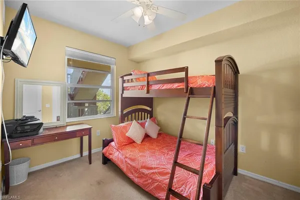 a bedroom with furniture and a window