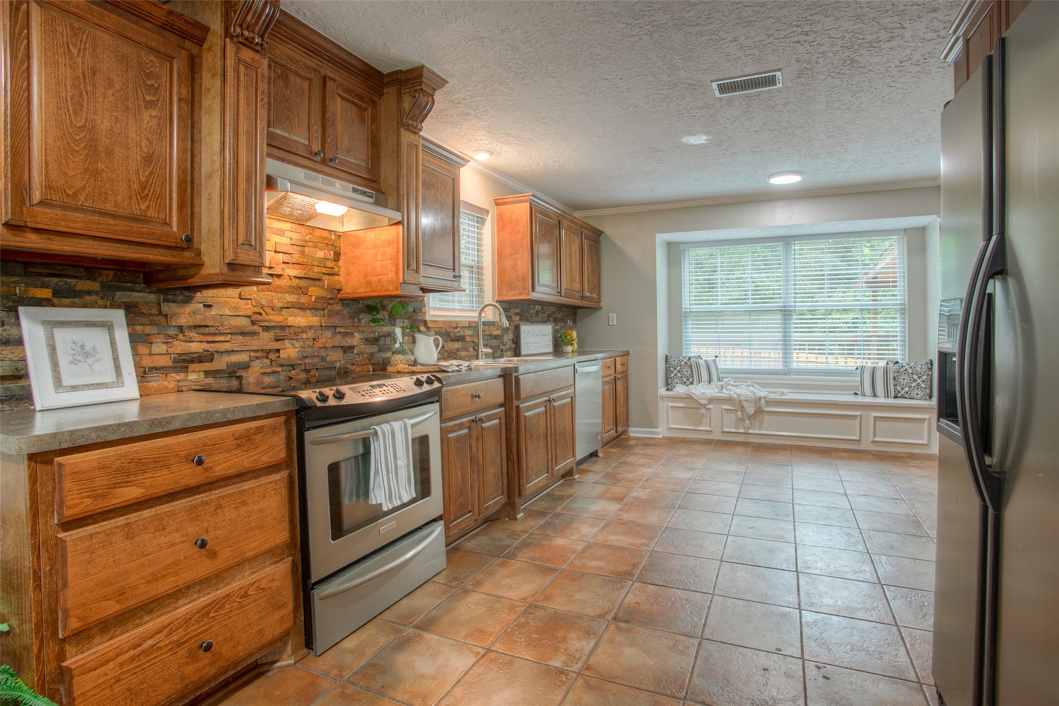 6016 Teas Nursery Road Conroe, TX 77304 - Photo 12 of 50 Gorgeous kitchen features tile flooring and an abundance of cabinetry.