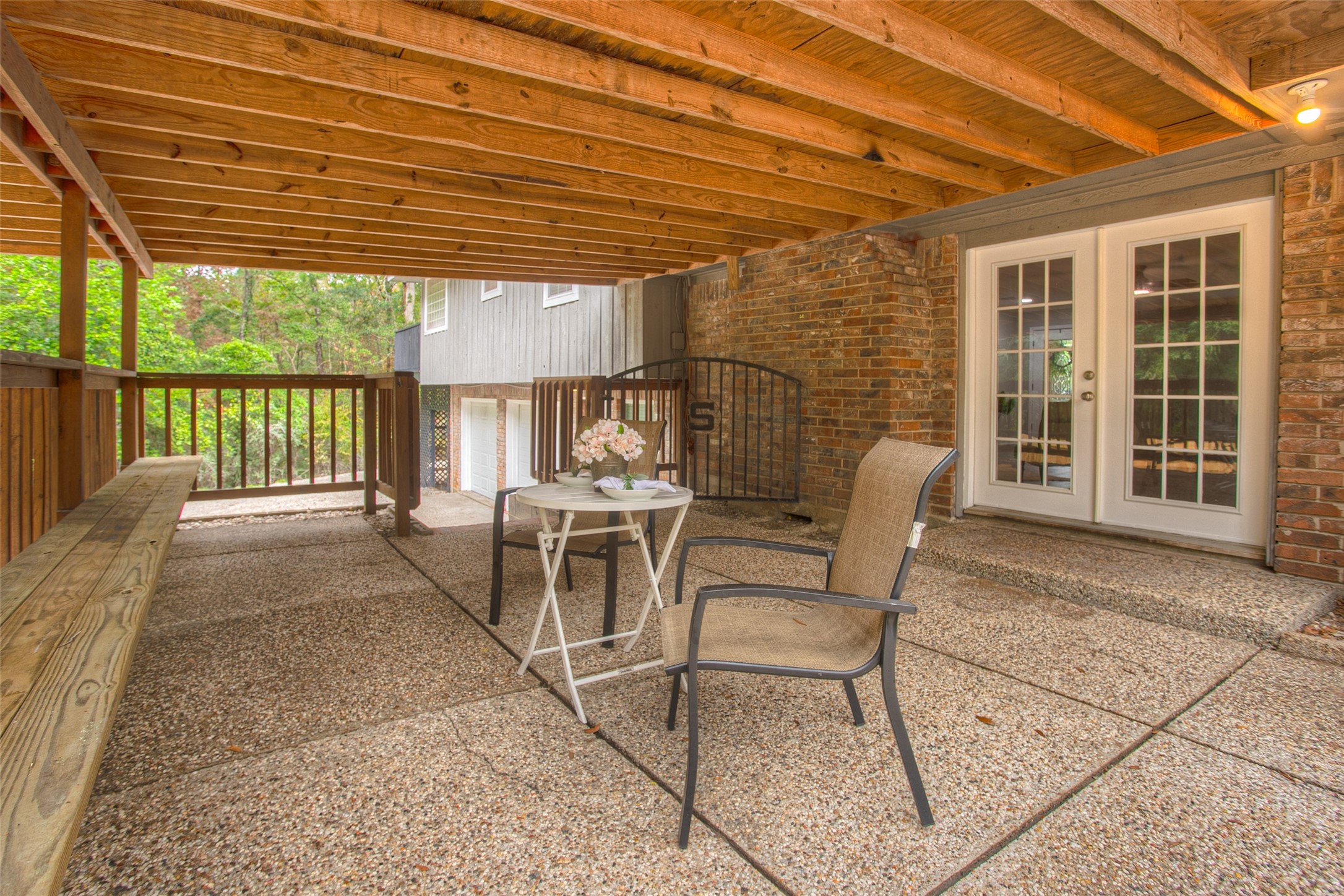 6016 Teas Nursery Road Conroe, TX 77304 - Photo 7 of 50 The French doors open to an expansive covered patio.