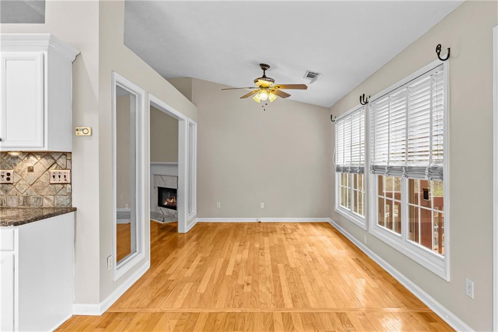 3360 Ennfield Lane Duluth, GA 30096 - Photo 11 of 38 a view of empty room with a window and wooden floor