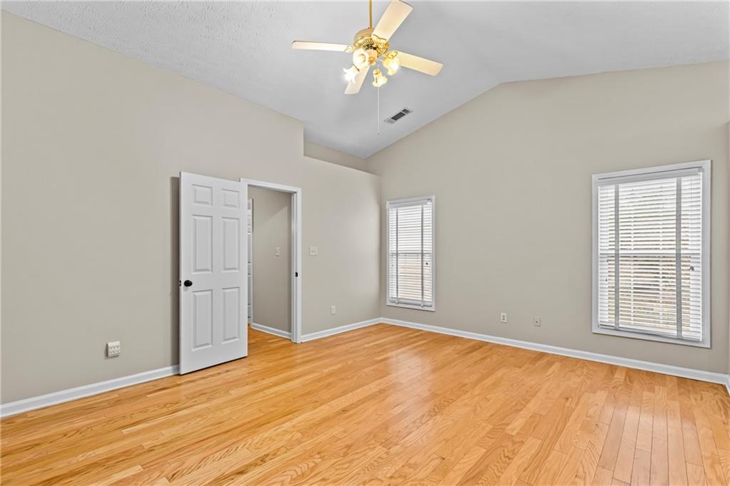 3360 Ennfield Lane Duluth, GA 30096 - Photo 14 of 38 a view of empty room with wooden floor and fan