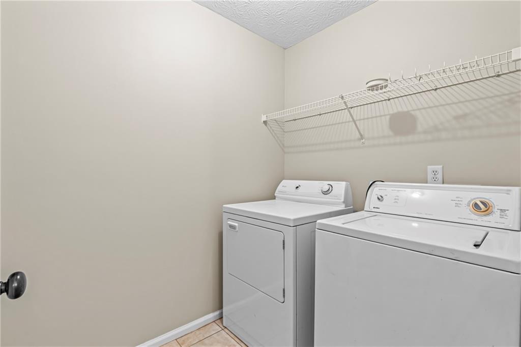 3360 Ennfield Lane Duluth, GA 30096 - Photo 24 of 38 a utility room with dryer and washer