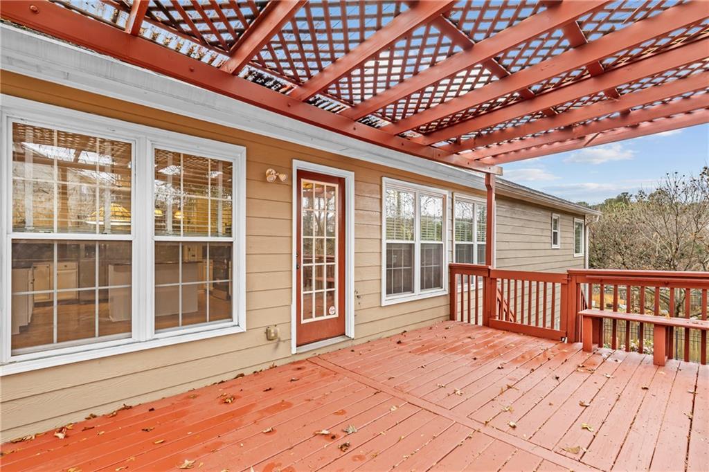 3360 Ennfield Lane Duluth, GA 30096 - Photo 28 of 38 a view of a porch with wooden floor and iron fence