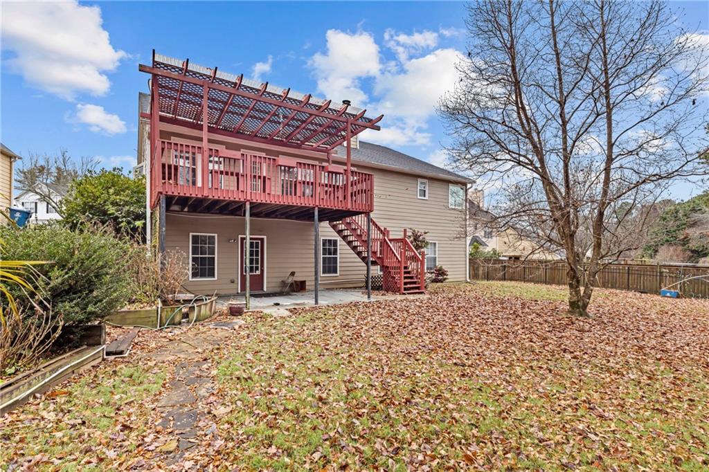 3360 Ennfield Lane Duluth, GA 30096 - Photo 29 of 38 a view of a house with a yard and seating space
