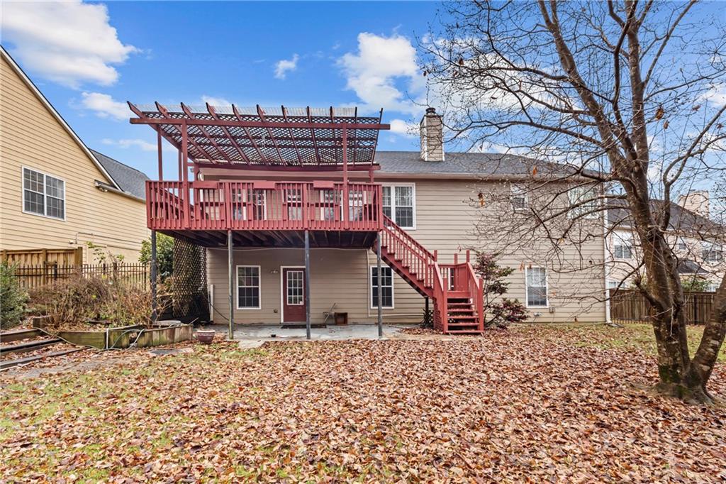 3360 Ennfield Lane Duluth, GA 30096 - Photo 30 of 38 a view of a house with a yard and wooden fence
